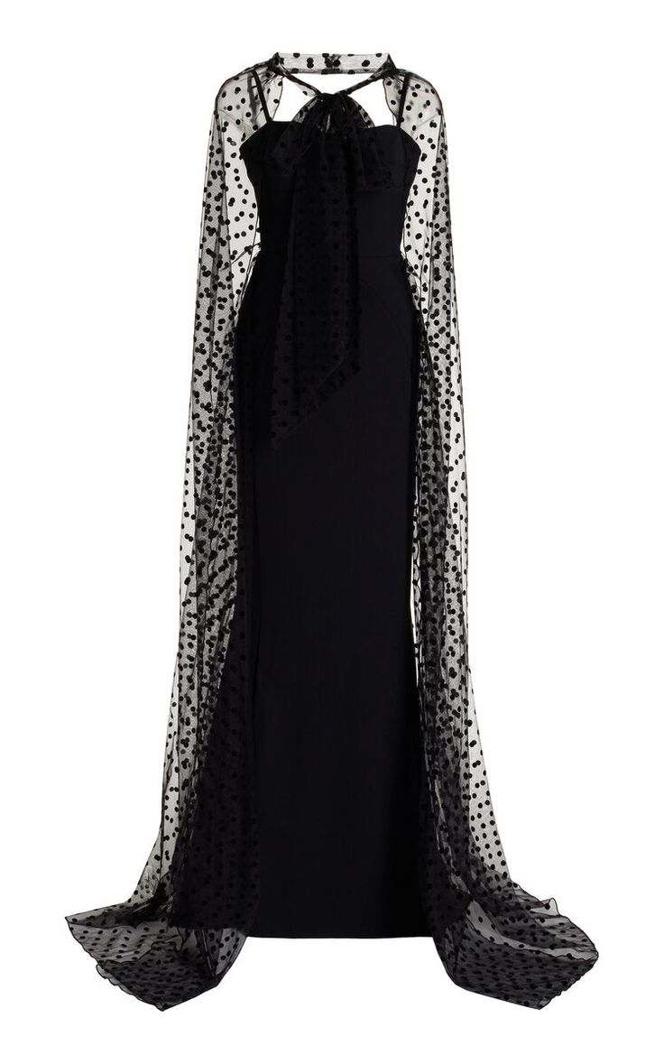 Make a statement at your event with the Greta Constantine Fanya-Laya gown. This stunning black tie design features a beautiful cape detail, making it the perfect choice for weddings and other special occasions. Let your style shine with this must-have piece. True to size 68% polyamide | 32% elastane Body 100% Silk Wool Top Made in Toronto | Fabric milled in Italy Dry Clean *Note that Special Order pieces take 22 - 26 weeks to ship. Glamorous Cape Sleeve Evening Dress For Formal Events, Elegant Evening Gown With Cape Sleeves, Cape Evening Dress With Sweep Train, Formal Evening Dress With Cape Sleeves, Luxury Gala Gown With Cape Sleeves, Luxury Gown With Cape Sleeves For Gala, Glamorous Formal Gown With Cape Sleeves, Fitted Cape Evening Dress For Gala, Party Gown With Sweep Train And Cape Sleeves