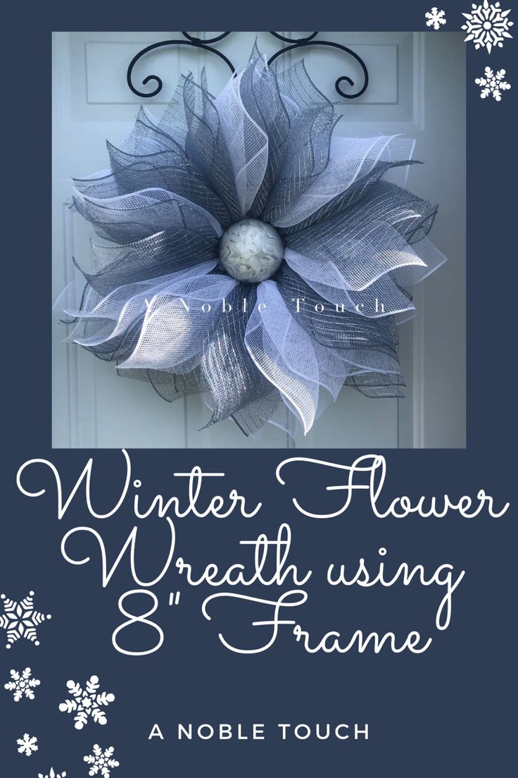 a blue and white wreath with snowflakes on it