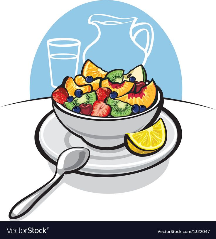 a bowl of fruit salad on a plate with a glass of water in the background