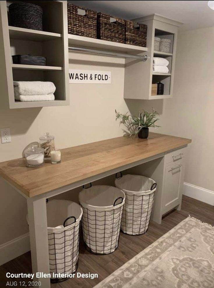 a wash and fold laundry room with baskets on the counter