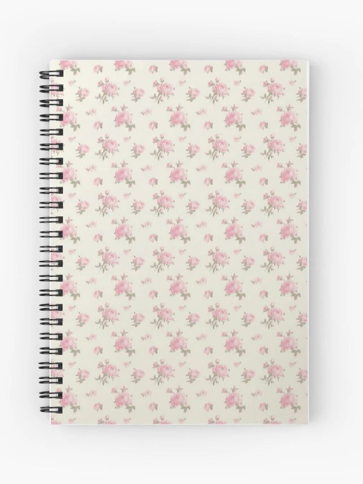 a spiral notebook with pink flowers on it