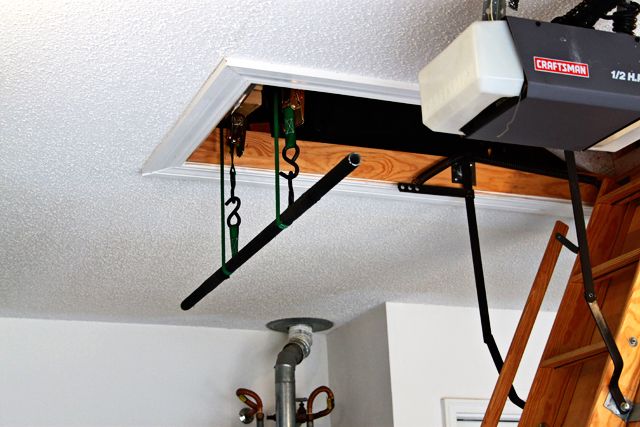 a camera is hanging from the ceiling above a ladder