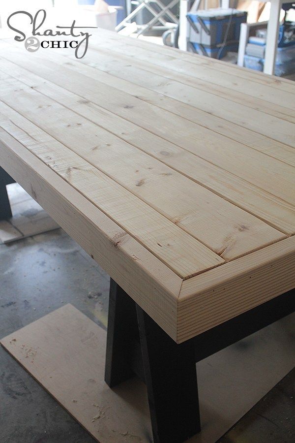 a large wooden table sitting inside of a room