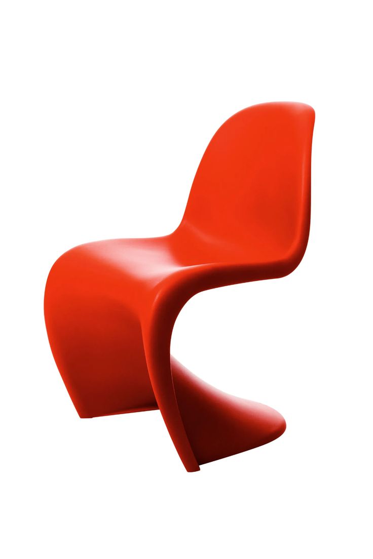 an orange chair sitting on top of a white floor next to a red object with one leg up