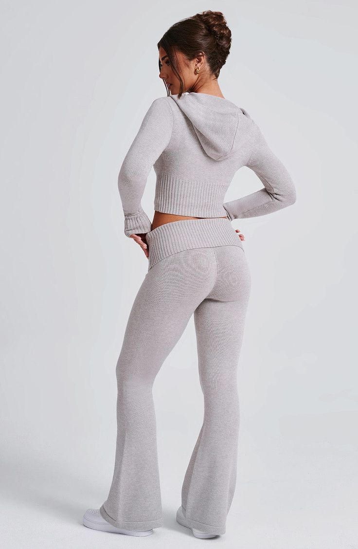 The Portia Knit Pants are a must-have for any wardrobe. These versatile pants feature a flattering fit and flare silhouette, with a wide rib waistband for added style. Complete the look with the matching Portia knit hoodie. 



Colour: Light Grey Marl.

Regular length.

Unlined.

Fit and flare silhouette.

Wide 2x2 rib waistband.

Fold over waistband detail.

Internal elastic in waistband.

Model is an XS and is wearing an XS.

 Size: XS, S, M, L, XL, XXL Homecoming Dresses Corset, Pink Monochrome, White Dress Spring, Midi Dress Wedding Guest, Versatile Pants, Maxi Dress Sale, Looks Street Style, Basic Fits, Sparkle Dress