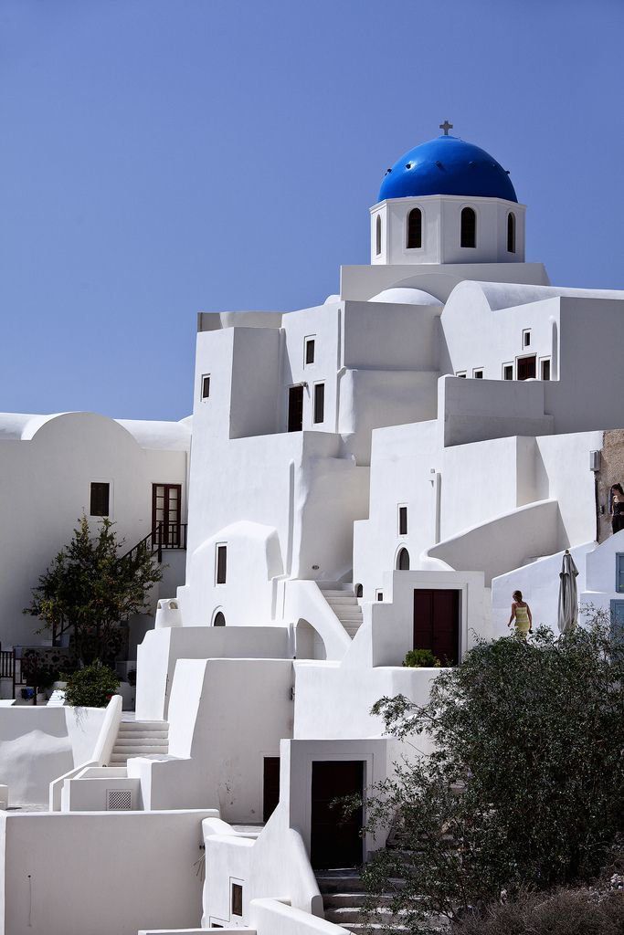 a white building with a blue dome on top