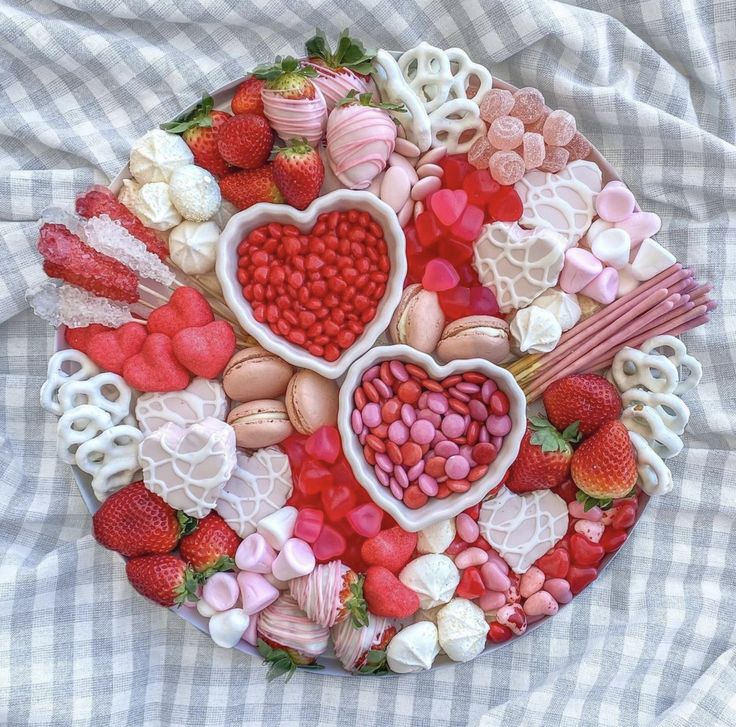 a plate filled with lots of different types of food on top of a checkered table cloth