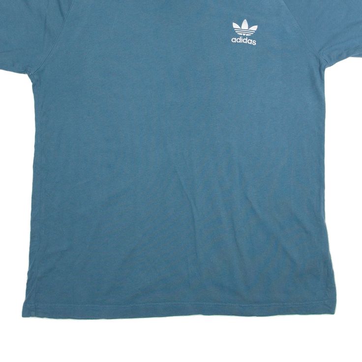 Item is in good used condition. >Size: L >Armpit To Armpit: 21" >Armpit To Cuff: 5" >Collar To Hem: 30" Basic Blue Sports T-shirt, Basic Blue T-shirt For Sports, Sporty Blue T-shirt With Three Stripes Branding, Blue Adidas Logo Tops For Streetwear, Blue T-shirt With Three Stripes Branding, Blue T-shirt With Three Stripes For Streetwear, Blue Adidas Logo Cotton Top, Blue Cotton Adidas Logo Tops, Casual Blue Adidas Logo Top