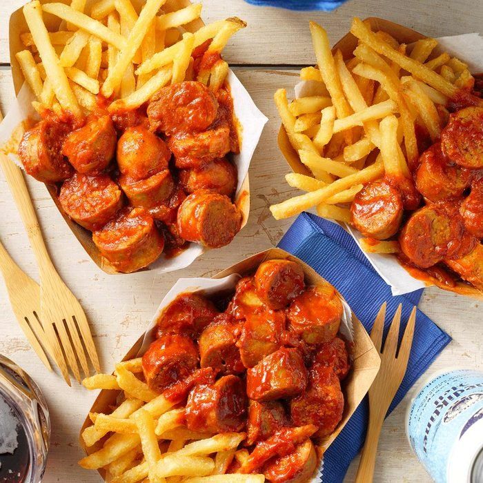 three bowls filled with french fries and meatballs