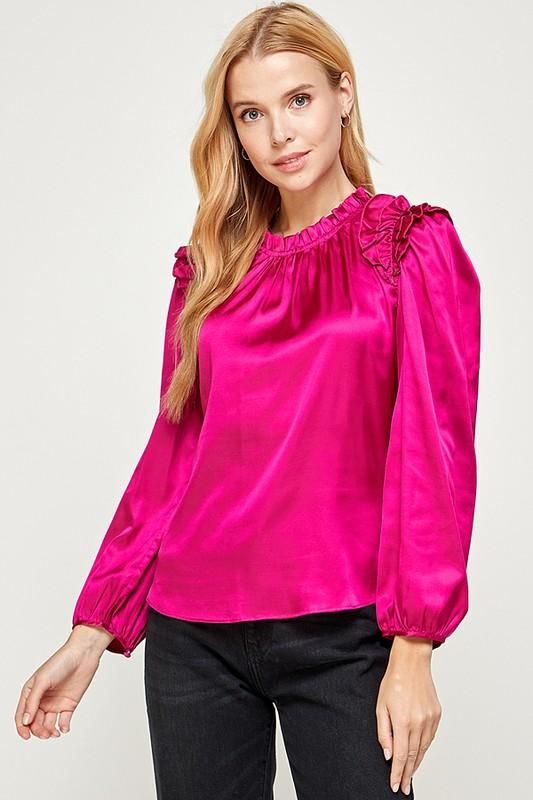 long sleeve top with pleated ruffle detail. Spring Long Sleeve Tops With Ruffle Hem, Ruffled Collar Tops For Night Out, Night Out Tops With Ruffled Collar, Tops With Ruffled Collar For Night Out, Spring Ruffled Long Sleeve Top, Spring Long Sleeve Ruffled Tops, Long Sleeve Ruffled Tops For Night Out, Pleated Sleeve Tops For Fall Party, Fall Party Tops With Pleated Sleeves