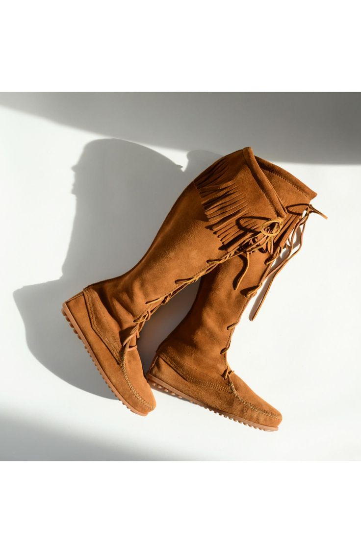 A fringed cuff tops a hand-sewn boot finished with rawhide laces. Approx. boot shaft height: 17 1/2"; 15" calf circumference Suede upper/leather lining/rubber sole. By Minnetonka; imported of domestic materials. BP. Shoes. Laced Suede Boots For Fall, Western Suede Moccasins For Fall, Western Style Suede Moccasins For Fall, Casual Suede Boots For Rodeo, Bohemian Winter Suede Boots, Fall Fringe Boots With Snip Toe, Brown Leather Lace-up Boots With Suede Lining, Western Style Suede Boots With Fringe, Bohemian Suede Winter Boots