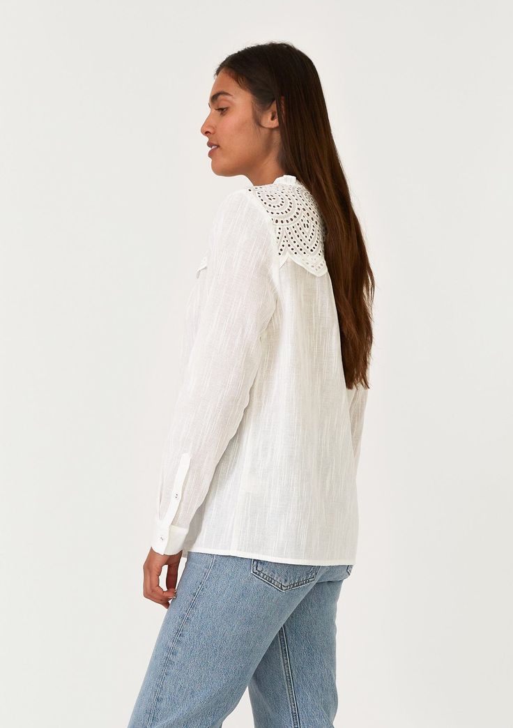 An ultra-pretty bohemian blouse with long sleeves and a sheer eyelet lace yoke detail. Cotton eyelet lace yoke Relaxed fit Long sleeve Button cuff closure Ruffled round neckline Self-covered button front Bohemian spring blouse A sheer eyelet lace yoke detail adds a feminine touch to this timeless bohemian blouse. With long sleeves, a self-covered button front, and a ruffle-trimmed round neckline. Perfect for the office or the weekend, this versatile style pairs well with denim. Model is 5'9, wea Casual Lace Top With Lace Collar, Casual Long Sleeve Lace Top With Lace Collar, Long Sleeve Cotton Crochet Top With Lace Trim, Long Sleeve Cotton Blouse With Crochet Trim, Long Sleeve Crochet Cotton Top With Lace Trim, Relaxed Fit Blouse With Lace Trim For Daywear, Cotton Long Sleeve Blouse With Crochet Trim, Cotton Crochet Top With Lace Trim, Cotton Blouse With Crochet Trim Long Sleeve