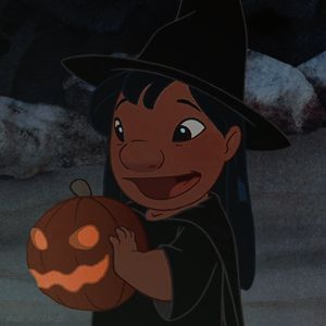 an animated image of a witch holding a pumpkin