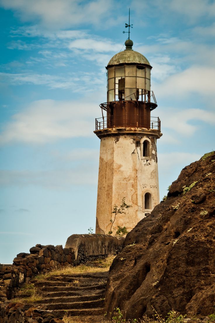 an old light house on top of a hill