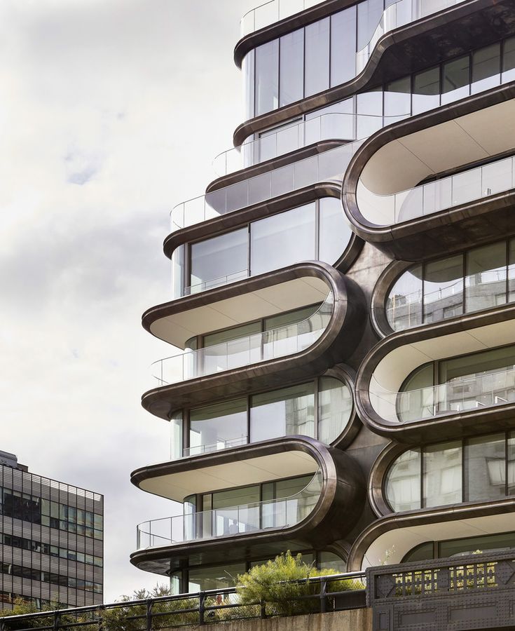 a tall building with many balconies on the side