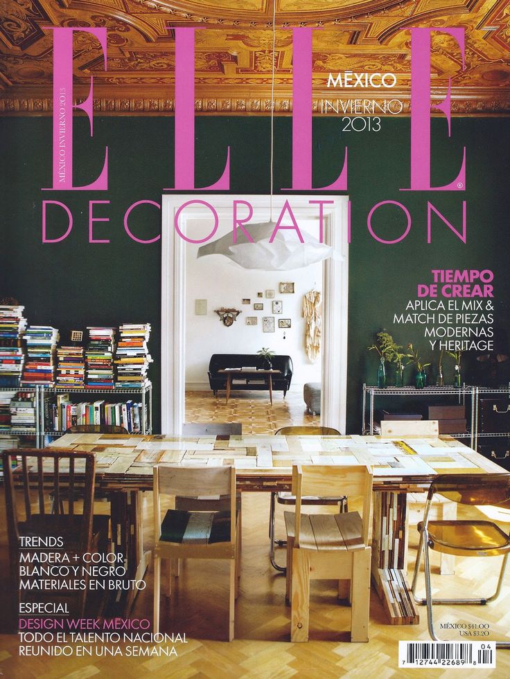 a magazine cover with an image of a dining room and bookshelf in the background