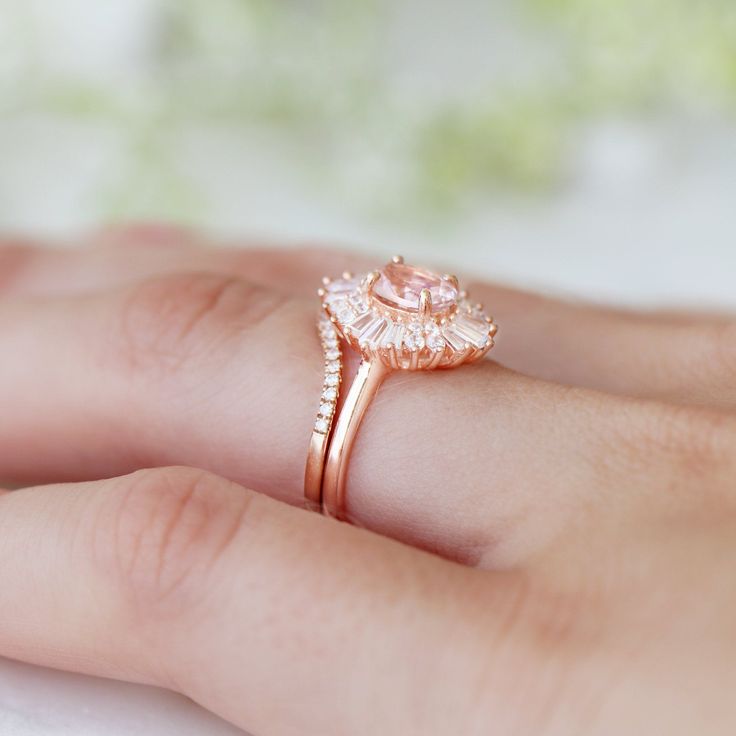 Beautiful Victoria Morganite Art Deco Ring ►Vintage Inspired design ►Base Metal: Sterling Silver (925) ►Plating: 14K Rose Gold ►Accented With Simulated Diamonds (CZ) ►Average band width: 1.8 mm ►Halo size: 13.5 mm x 12.1 mm Main Stone: Morganite Gemstone Creation: Lab-Created Stone Shape: Oval Cut Gem size: 7.0 x 5.0 mm Carat Weight: 0.76 ct. (Approx.) ►This ring can be customized to natural morganite, or any other gemstone of your choice. Please contact us if you have special requests. ►Please Pink Brilliant Cut Cluster Ring For Wedding, Pink Brilliant Cut Wedding Rings, Pink Gold Solitaire Wedding Jewelry, Pink Gold Solitaire Jewelry For Wedding, Rose Gold Rings With Center Stone For Wedding, Pink Cubic Zirconia Halo Ring For Wedding, Rose Gold Wedding Rings With Center Stone, Marquise Rose Gold Ring For Anniversary, 14k Rose Gold Cluster Ring For Wedding