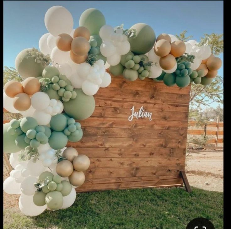 a wooden box with balloons attached to it