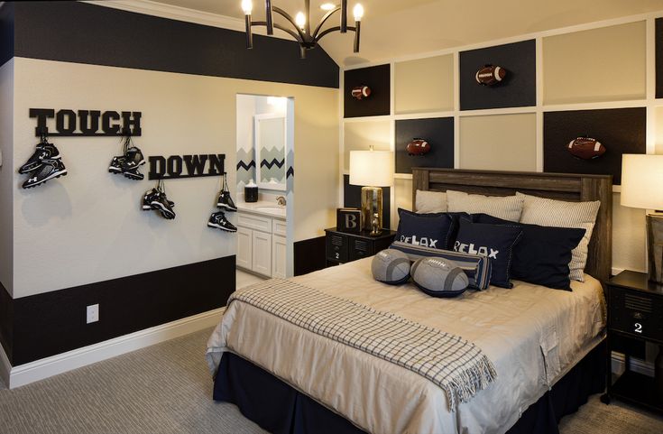 a bedroom with black and white decor on the walls