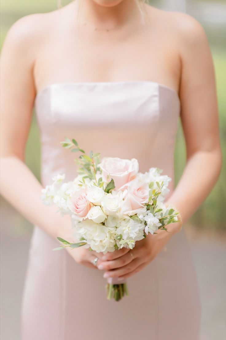 a bride holding her bouquet in her hands