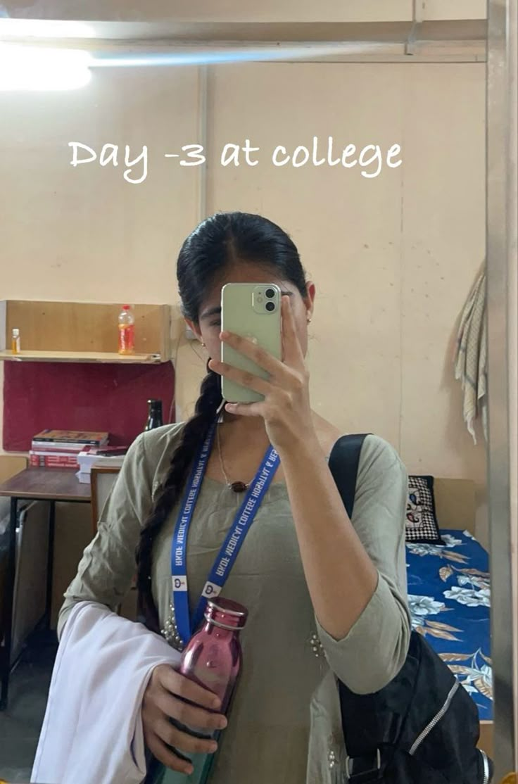 a woman taking a selfie in front of a mirror with the words pay = at college