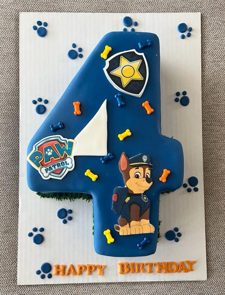 a birthday cake with paw patrol number four on it