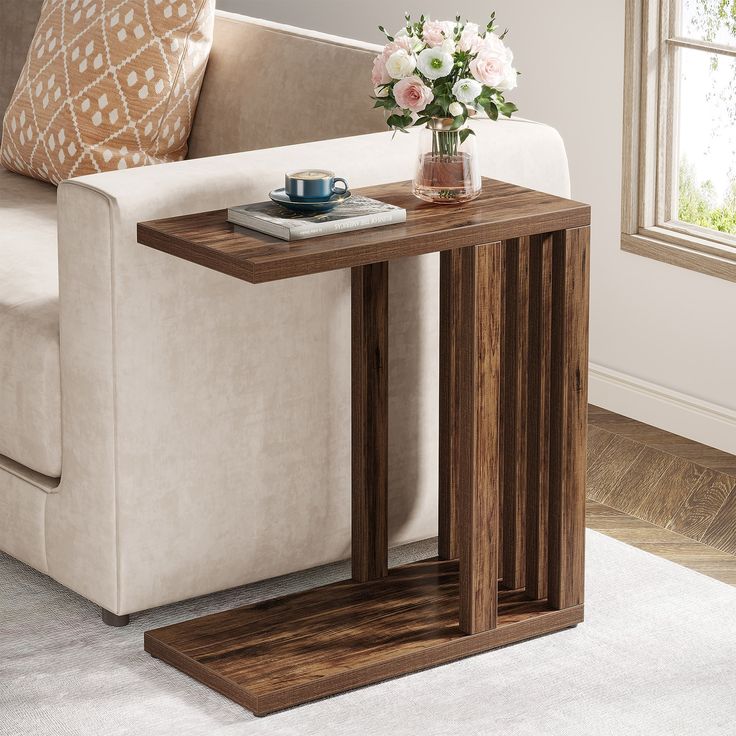 a wooden table sitting on top of a white couch