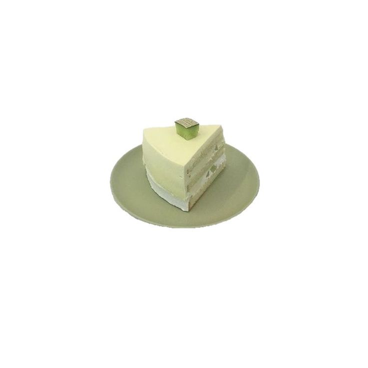 a piece of cake sitting on top of a green plate with a white frosting