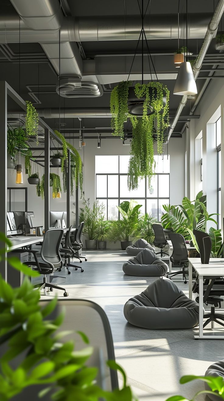 an office filled with lots of green plants and bean bags on the floor next to desks