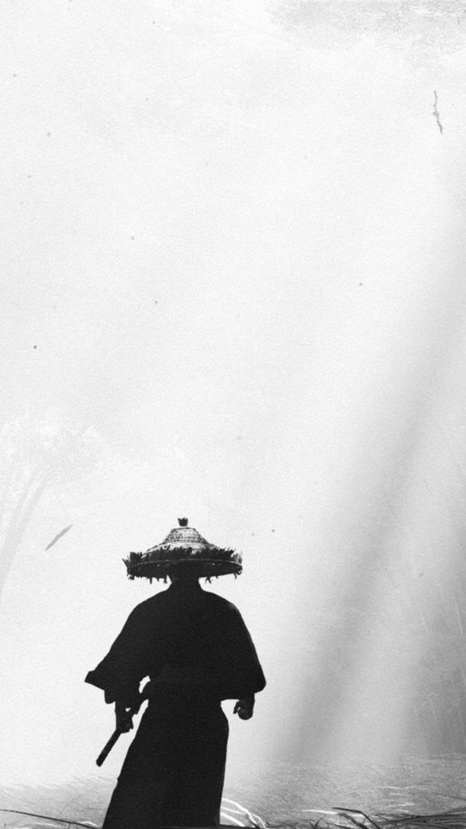 an old photo of a person walking in the snow with a hat on their head