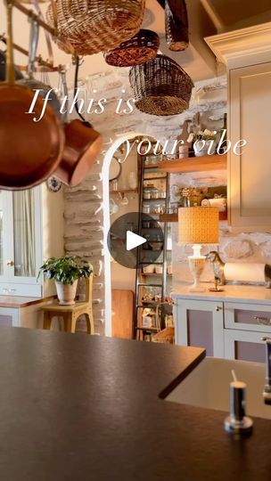 a kitchen with pots and pans hanging from the ceiling