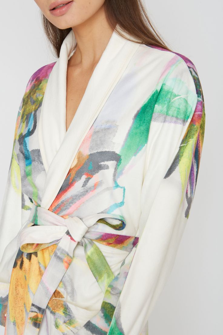 Indulge in the soft, absorbent, and breathable fabric of this Aquarelle Short Robe. With a chic and classy design, it is machine washable and will bring out your inner artist. You will love the comfortable and stylish feel of this robe. One size Short bath/lounge Robe Shawl collar 2 bottom side pockets Sewn in belt Made of soft and absorbent microfiber Machine wash cool Tumble-dry low Multicolor Silk Robe For Spring, Chic Summer Sleep Robe, White Silk Sleepwear For Spring, Summer Silk Loungewear Robe, Summer Silk Lounge Robe, White V-neck Robe For Spring, Fitted Kimono For Spring Loungewear, Cream Summer Robe For Loungewear, Silk Sleepwear For Spring Lounging