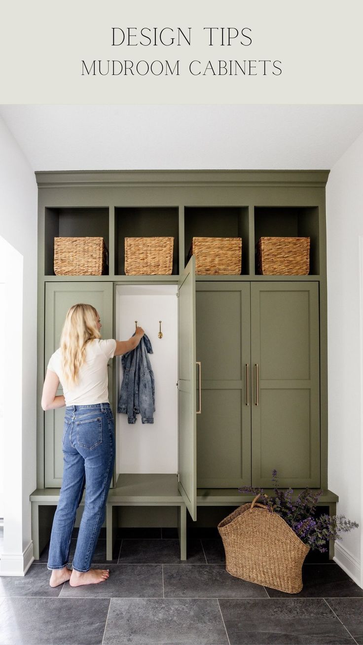 a woman standing in front of a green cabinet with clothes hanging on it and the words design tips for mudroom cabinets