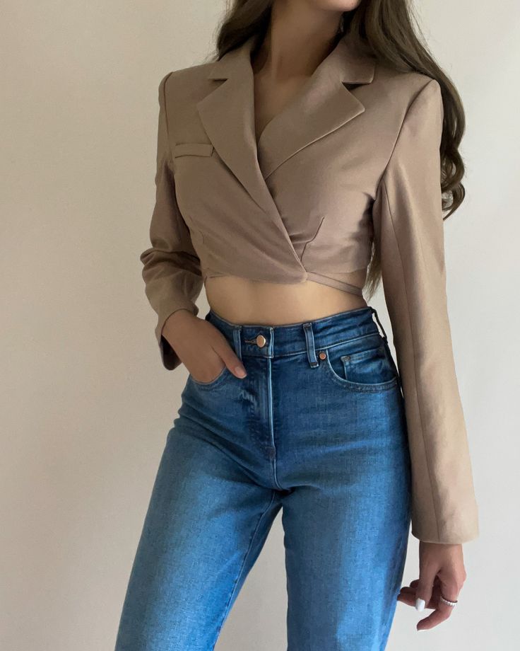 - Long Sleeves - Minimal Stretch - Notched Collar - Cropped Style - Wrap Around Detail - Open Back - Color: Taupe - True to size - Color may vary due to the lighting - Model is wearing a size small Model Details Height 5'7 | Chest 34" Cup size C | Waist 27" Hips 36.5" | Weight 125lbs | Wears a US size small in tops and dresses. Infinity Design, Cropped Blazer, Cropped Style, And Dresses, Notched Collar, Cup Size, Strappy Heels, Wrap Around, Cali