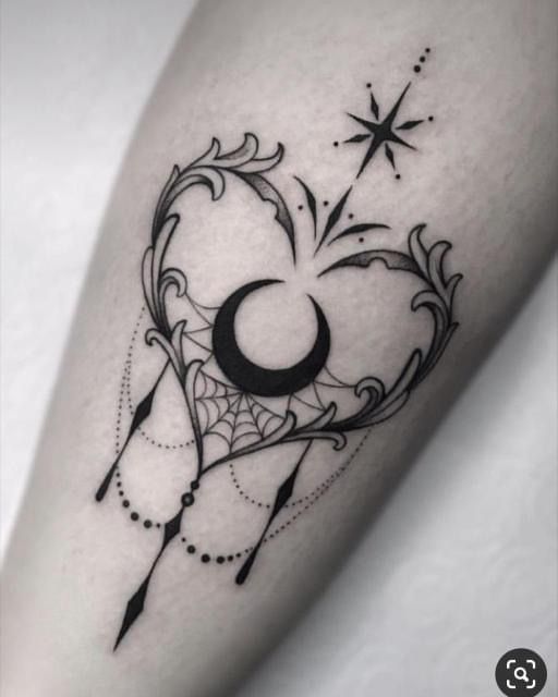 a black and white tattoo design on the leg