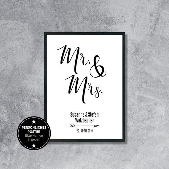 a black and white wedding sign with the word mr and mrs in cursive font