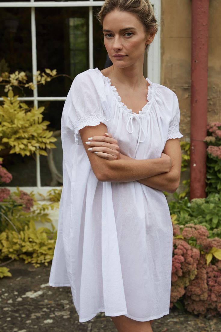 A family business, If Only If is obsessed with the classic nightgown from its timeless silhouette to the most special details. Crafted in 100% natural materials, these nightdresses are romantic, practical, and become even softer with every wash. Crafted from soft cotton, the Clover Smocked Cotton Voile Nightdress is made specially for those sultry summer nights. Featuring an adjustable drawstring neckline, and hand-smocked cap sleeves, it's a warm weather dream come true. Product Details 100% GO Lounge Wear Dress, Linen Nightgown, Cotton Night Dress, White Nightgown, Babydoll Nightgown, Drawstring Neckline, Cotton Nightgown, Pajama Dress, Farm Girl