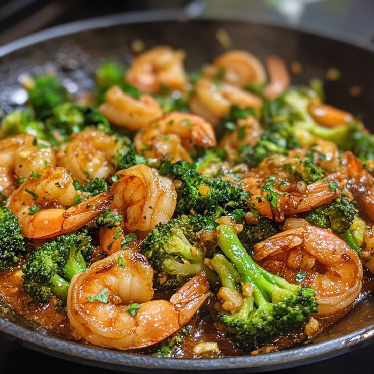 shrimp and broccoli stir fry in a skillet