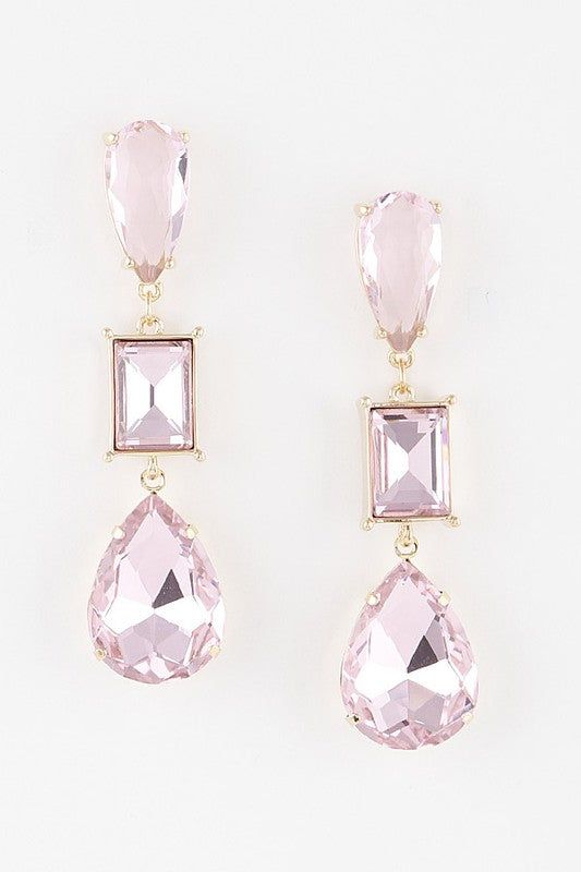 These are the perfect earrings to pair with your formal gown to complete your look. Crystal Drop Earrings 0.8 x 2.8" Approx. Lead & Nickel Exchanges We have a 7-day exchange policy, which means you have 7 days after receiving your item to request an exchange. We only do exchanges or instore credit. We do not offer refunds!To be eligible for an exchange, your item must be in the same condition that you received it, unworn or unused, with tags, and in its original packaging. Free of make-up, deodo Pink Drop Crystal Earrings For Wedding, Trendy Pink Crystal Drop Earrings, Elegant Pink Crystal Earrings, Elegant Pink Crystal Drop Earrings, Pink Crystal Drop Earrings, Crystal Drop Earrings, Crystal Drop, Gold Drop Earrings, Dream Jewelry