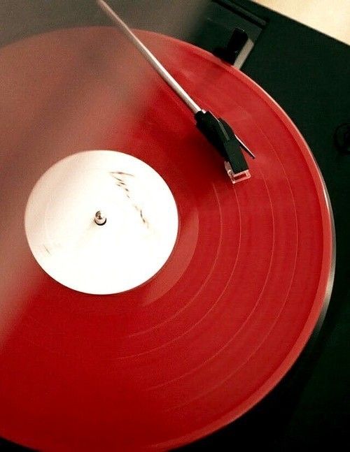 an old record player with red vinyl