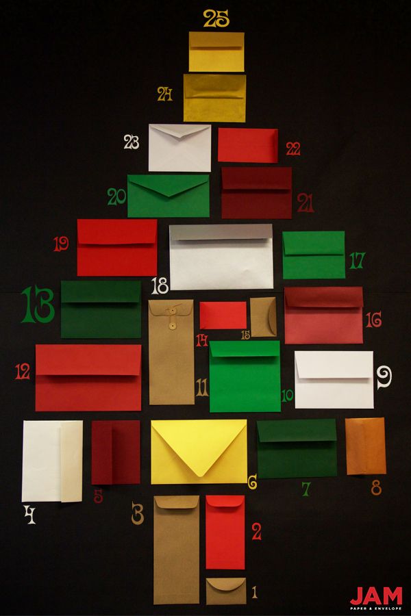 a christmas tree made out of different colored envelopes and numbers on a black background