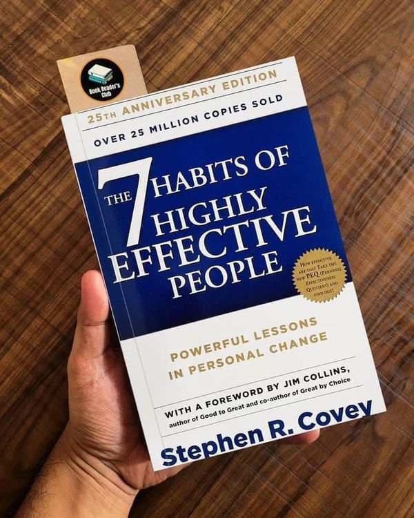 the 7 habitts of highly effective people book by stephen r covey on a wooden table