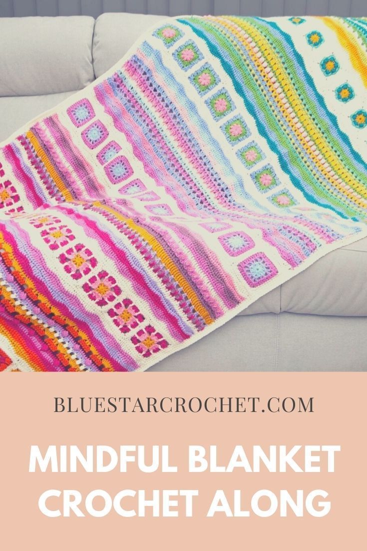 a colorful crocheted blanket sitting on top of a couch next to a pillow