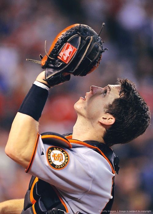 a baseball player is getting ready to catch the ball in mid air with his glove