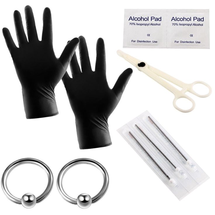 a pair of black gloves and two pairs of scissors