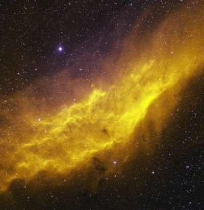 an orange and yellow cloud in the night sky with stars around it, as seen from earth