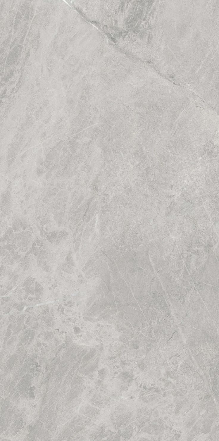 a white marble textured wall with grey veining