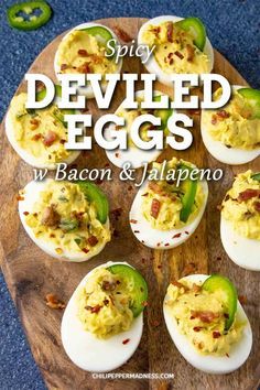 deviled eggs with bacon and jalapeno on a cutting board next to peppers