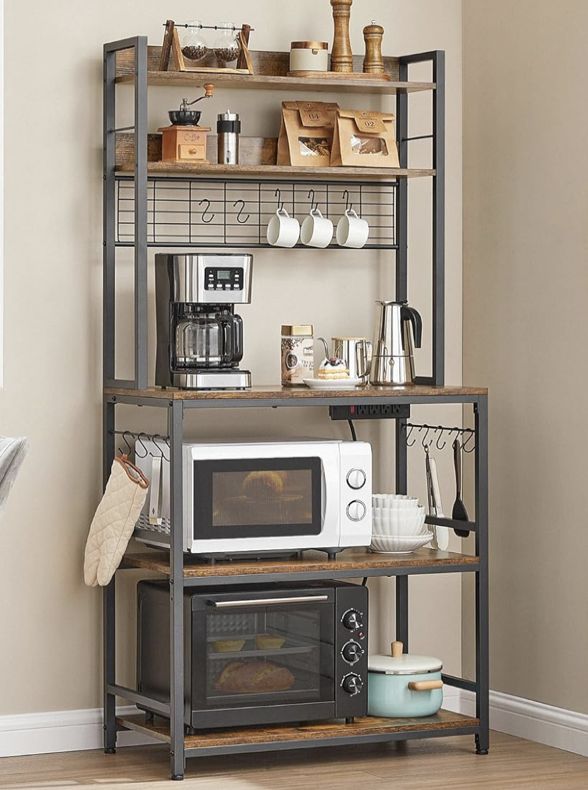 a microwave oven sitting on top of a wooden shelf