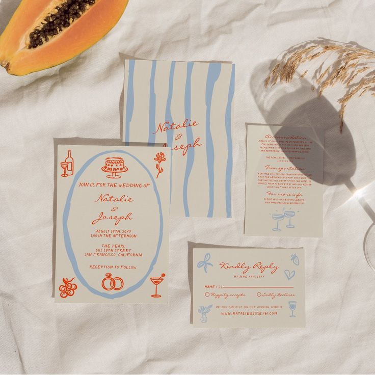 the wedding stationery is laid out on paper